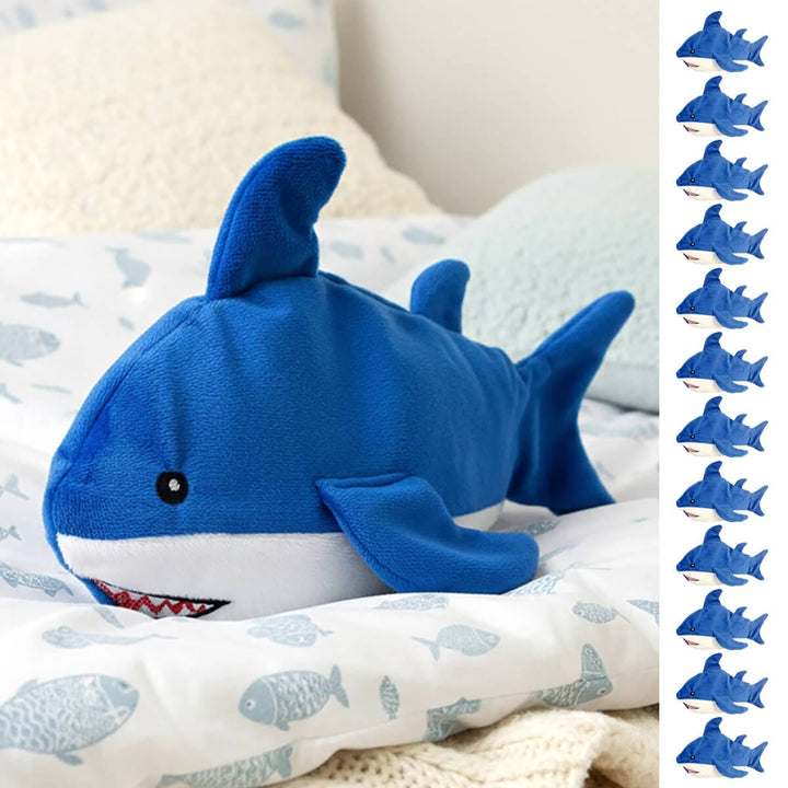 Blue shark plush shark heat pad on a fish printed quilt with fleece pillows