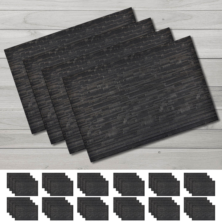 Set of black placemats on a wooden surface