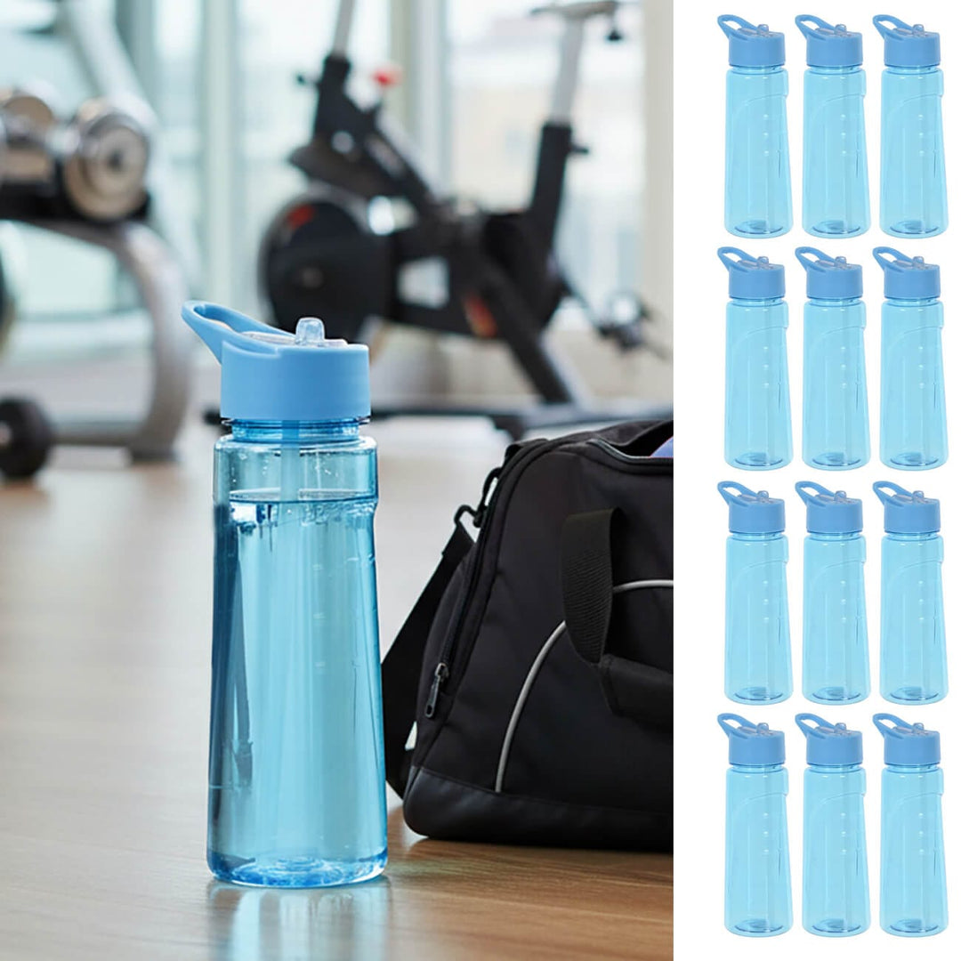 Blue water bottle on a gym floor with holdall and equipment
