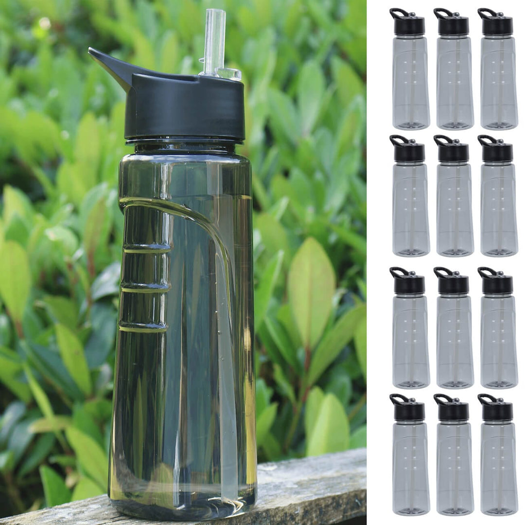 Grey water bottle on a wall in a garden with 12 small grey water bottles down one side