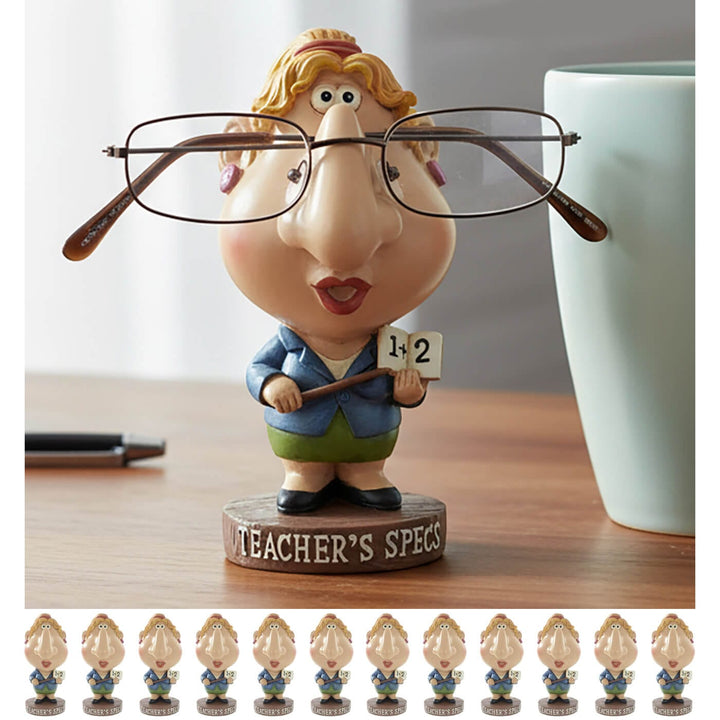 Teacher-themed eyeglass holder with multiple small figures on a wooden surface.