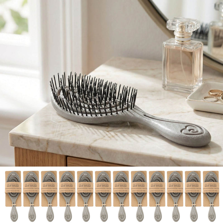 Grey hairbrush on a marble dressing table with a mirror and perfume bottle in the background