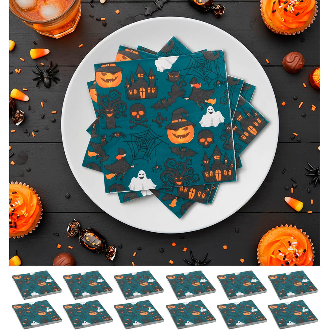 Halloween-themed paper napkins on a white plate with orange frosted cupcakes and halloween treats