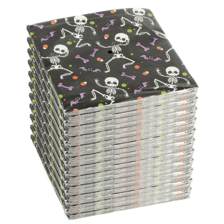 Stack of Halloween-themed napkins with skeletons and bones on a black background.