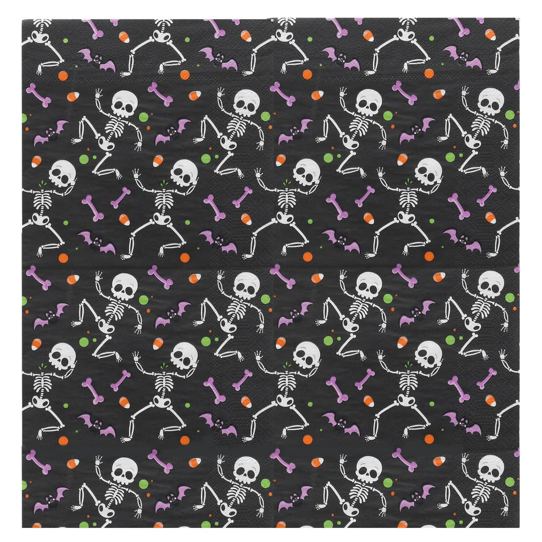 Pattern of skeletons and bones on a black background with colorful accents.