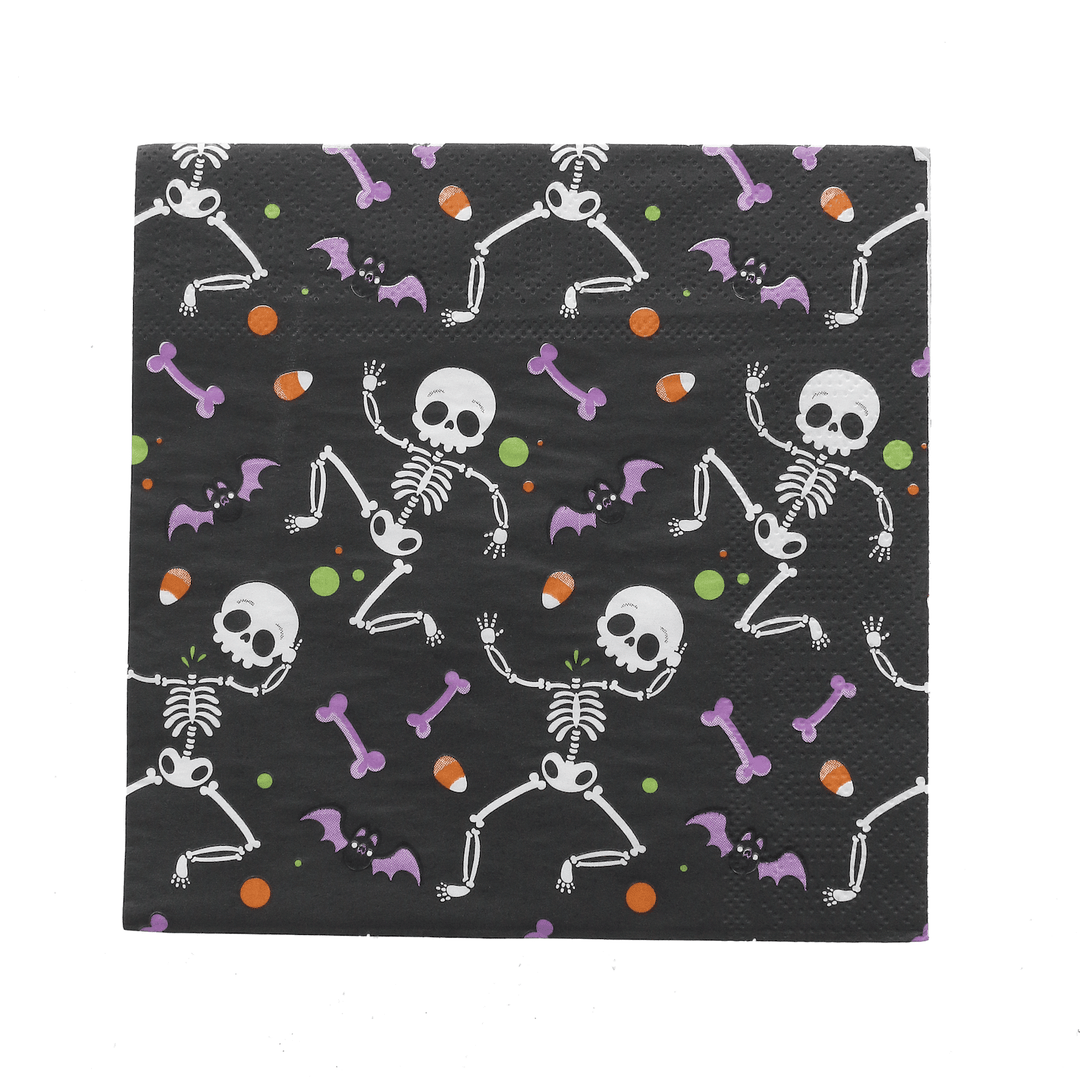 Black napkin with white skeleton design on a white background