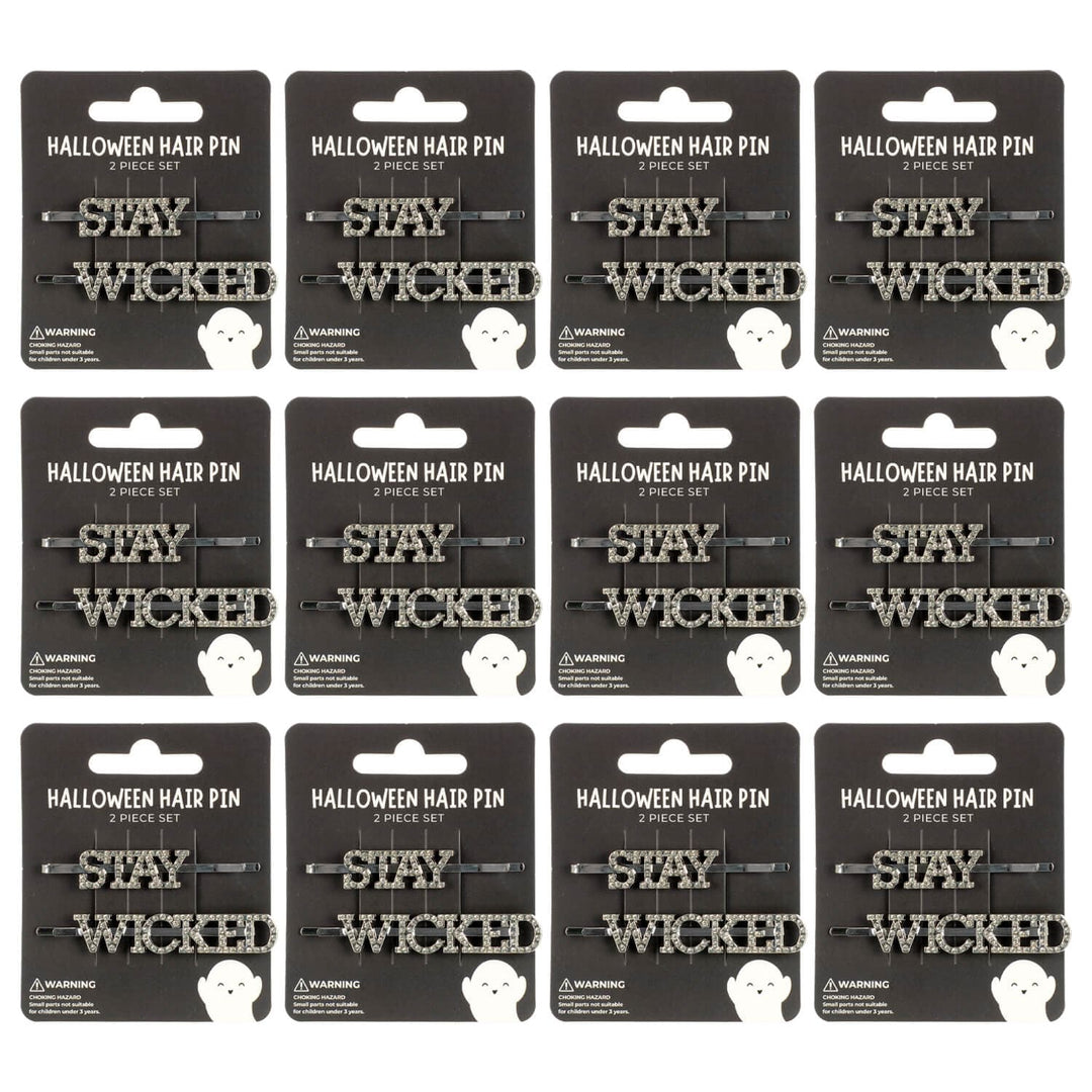 Display cards of 'Stay Wicked' Halloween hair pins on a white background