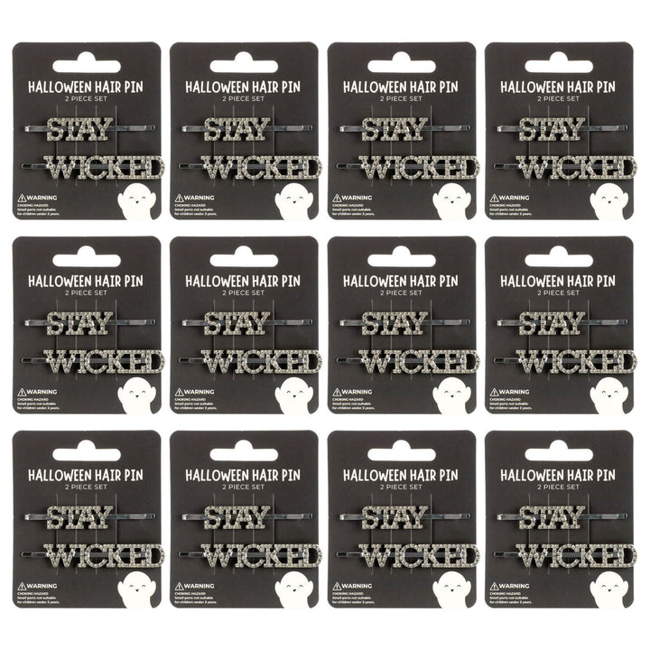 Display cards of 'Stay Wicked' Halloween hair pins on a white background