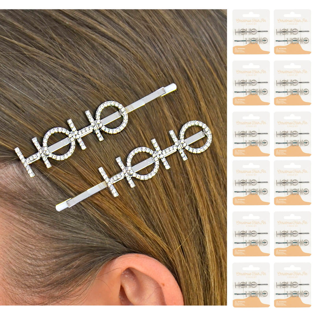 Hair clips with 'HO HO HO' text worn by a person, with display cards on the side.