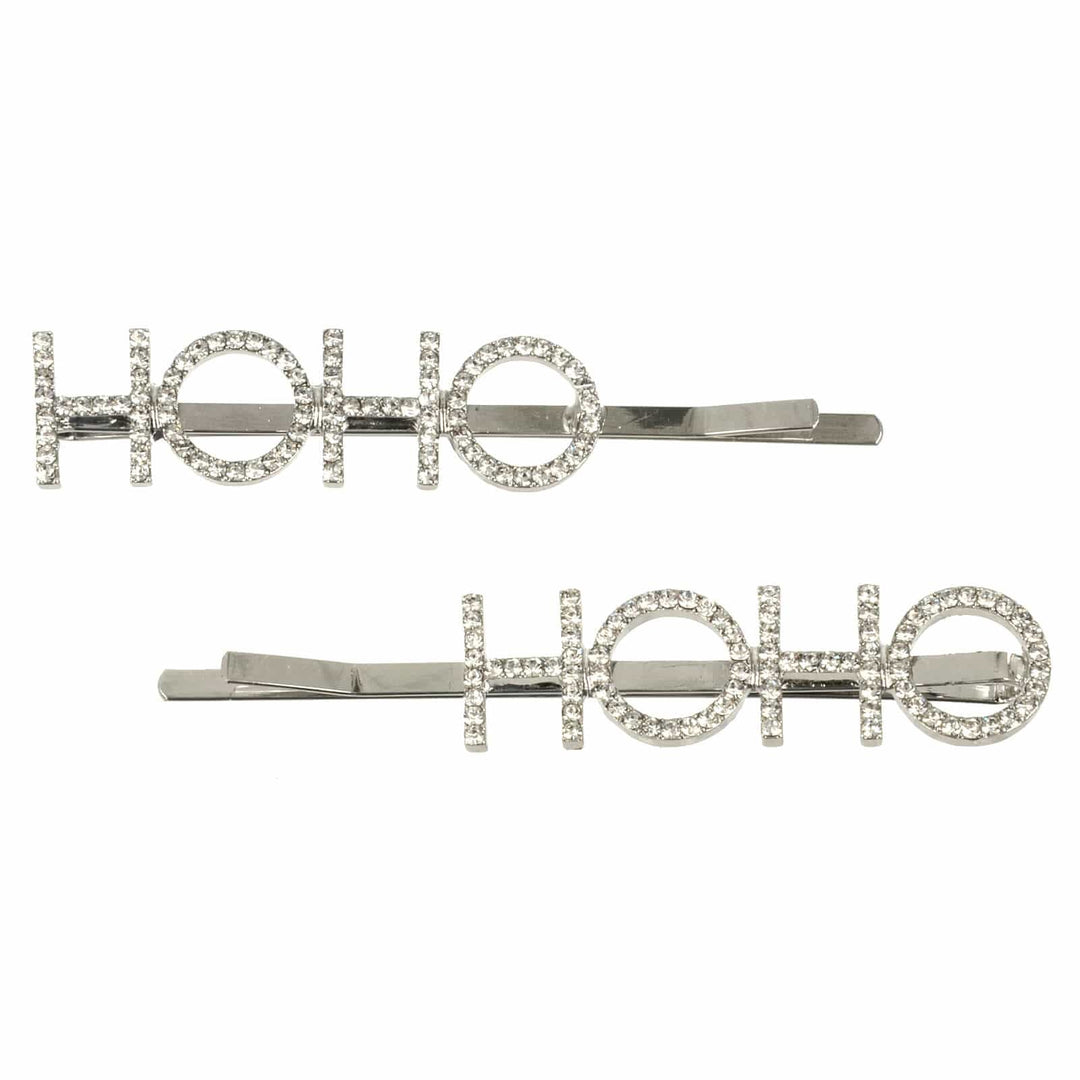 Two silver hair clips with 'HO HO' text on a white background