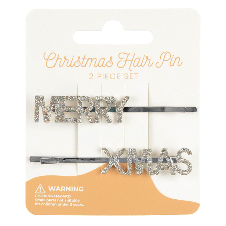 Two Christmas-themed hair pins on a packaging with 'Merry Xmas' text.