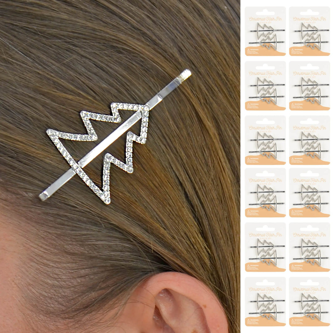 Person wearing a Christmas tree hair slide with sparkling diamante and display cards down one side
