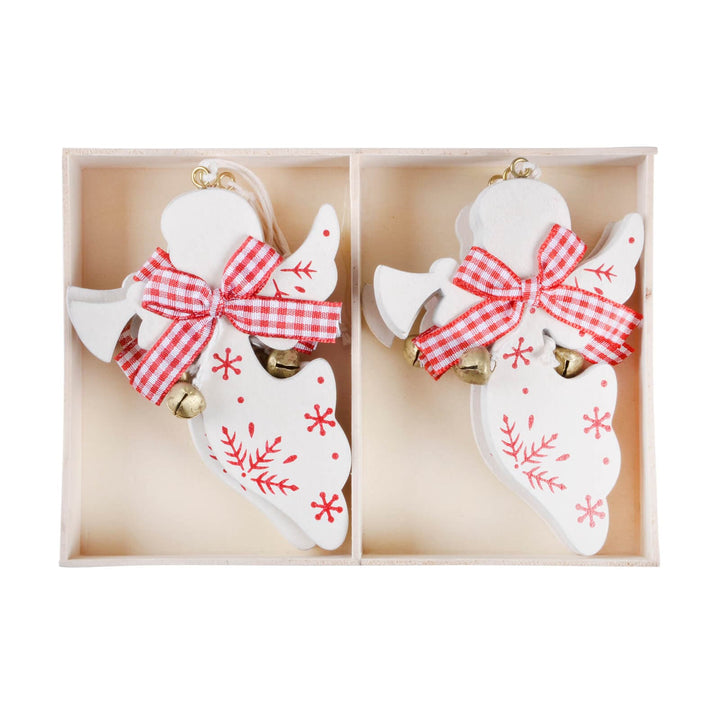 Two ceramic angel ornaments with red checkered bows and gold bells in a box.