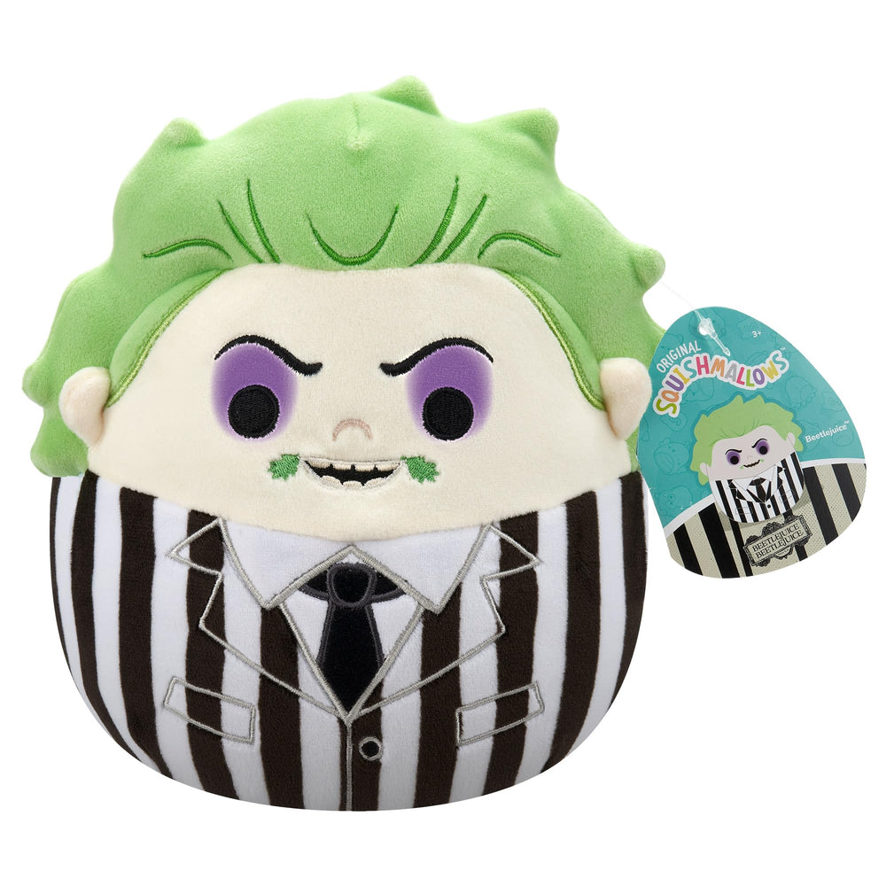 Plush toy resembling a beetlejuice character with green hair, purple eyes, and a striped outfit, with a tag on a white background.