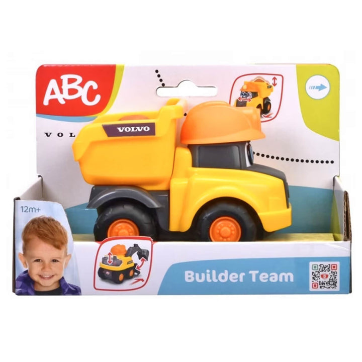 A yellow and orange toy dump truck in its original retail packaging, featuring the Volvo logo on the truck and an &