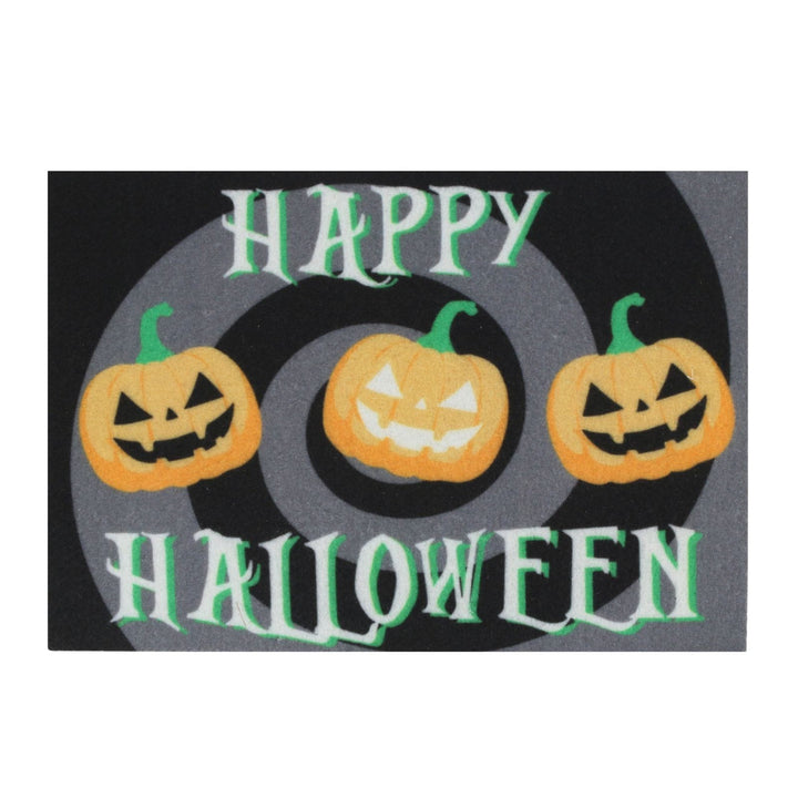 A rectangular Halloween-themed mat or sign with the words “HAPPY HALLOWEEN” in white and green lettering, featuring three orange jack-o&