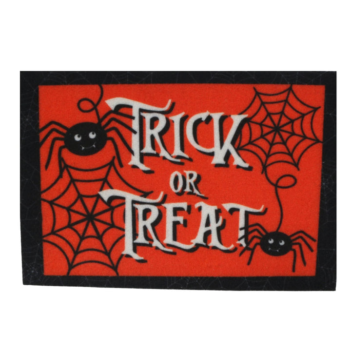 A rectangular Halloween doormat with a bright red background, black spiderwebs, two black cartoon spiders, and the words &
