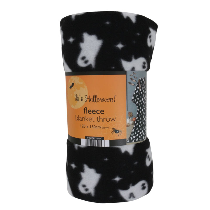 A rolled-up black fleece blanket throw with a white ghost pattern, wrapped in an orange paper label that reads &