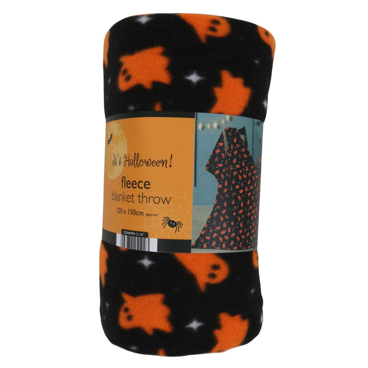 A rolled-up Halloween fleece blanket throw featuring a black background with orange ghosts and white stars, wrapped in a paper label that reads &