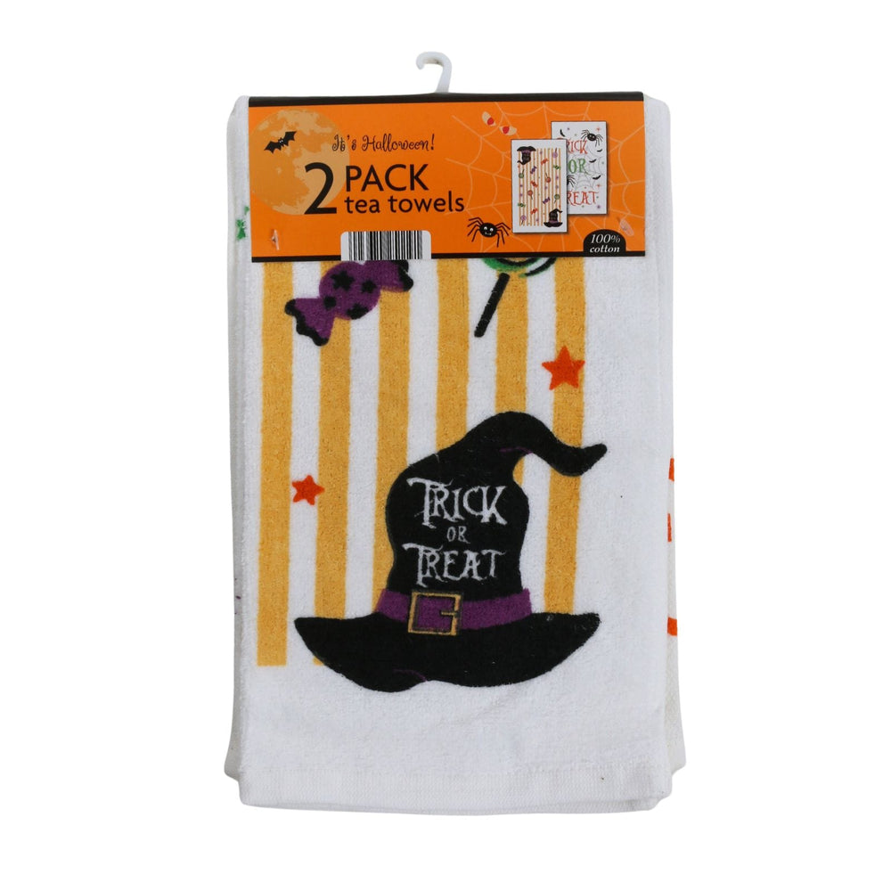 A 2-pack of Halloween-themed tea towels in retail packaging. The towels are white with a printed design featuring yellow vertical stripes, a black witch hat with a purple band and 'Trick or Treat' text, orange stars, and a purple spider.