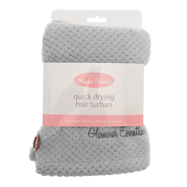 Grey colour quick drying hair turbie with packaging sleeve and hanger on a white background