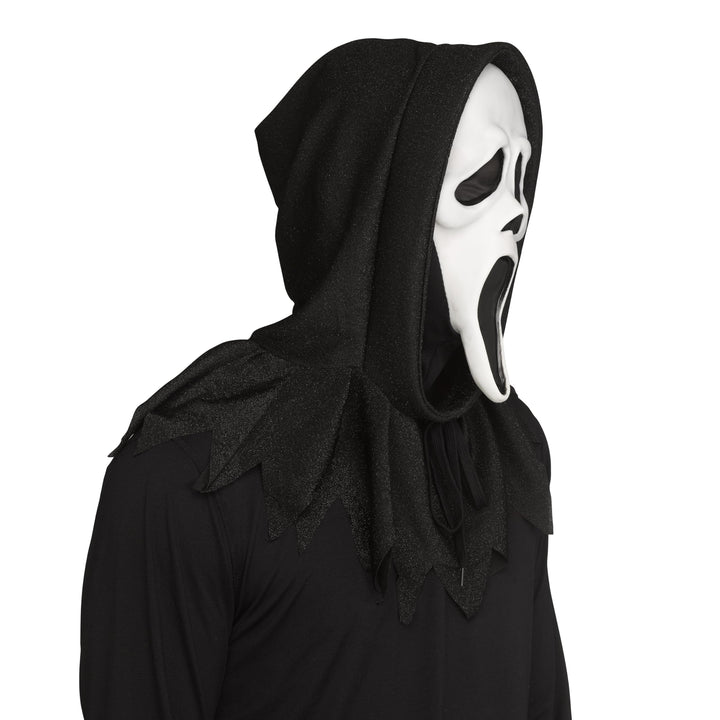 A person wearing a 30th Anniversary Ghost Face mask from the original Scream film with black shroud shown against a plain white background.