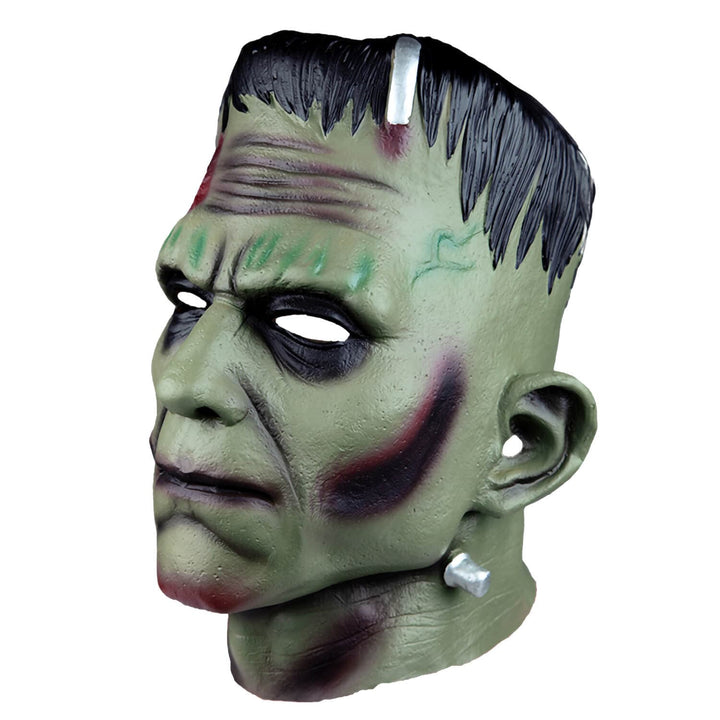 Green monster mask with black hair on a white background
