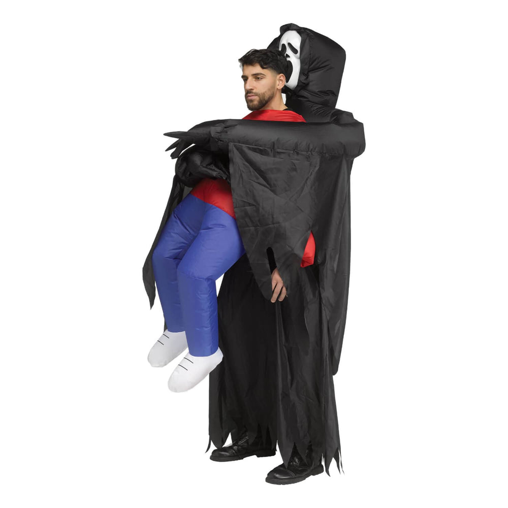 Profile of a man wearing an inflatable Scream carry costume for Halloween