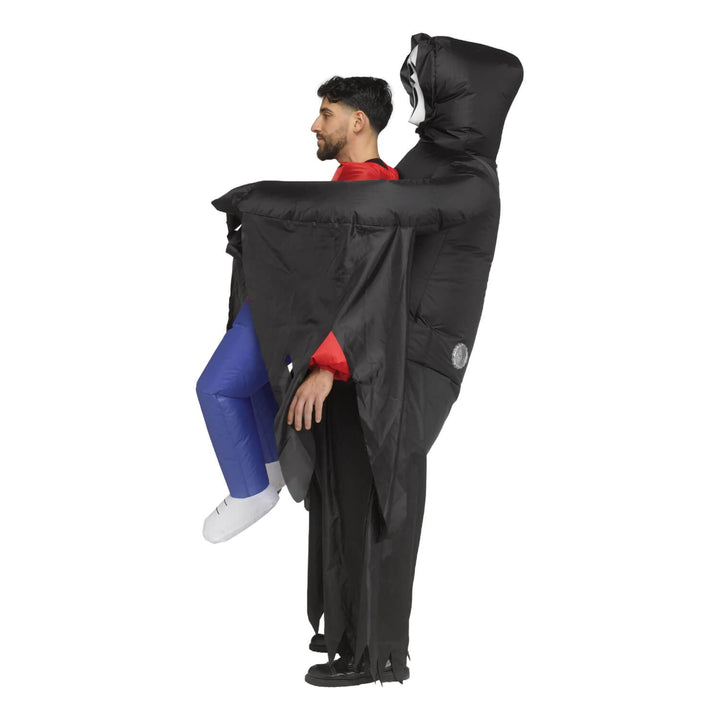 Profil eof a man wearing a Ghost Face inflatable carry me costume with red top and blue trousers