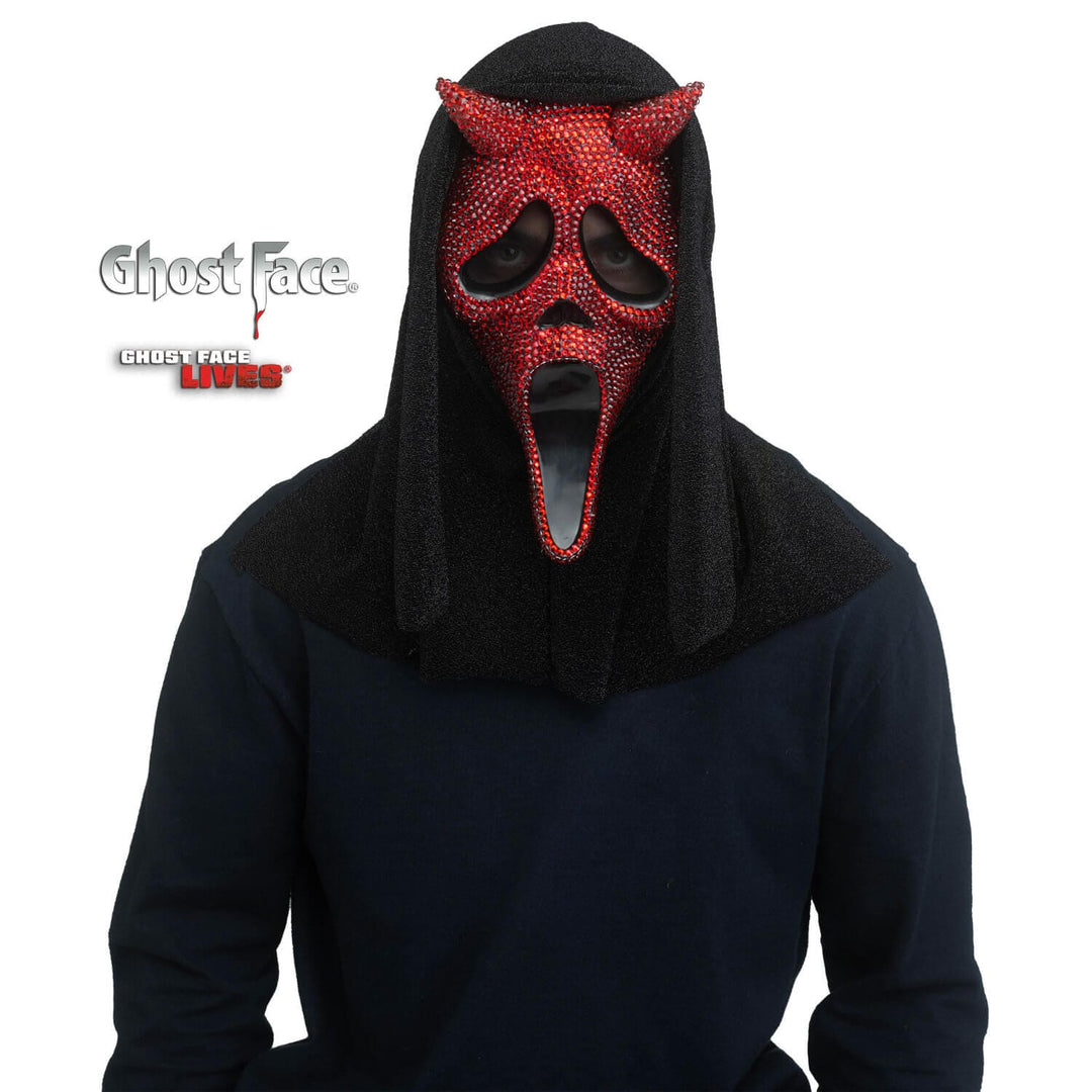 Person wearing a horned Devil design Ghost Face mask with red rhinestones  and a black hood on a white background