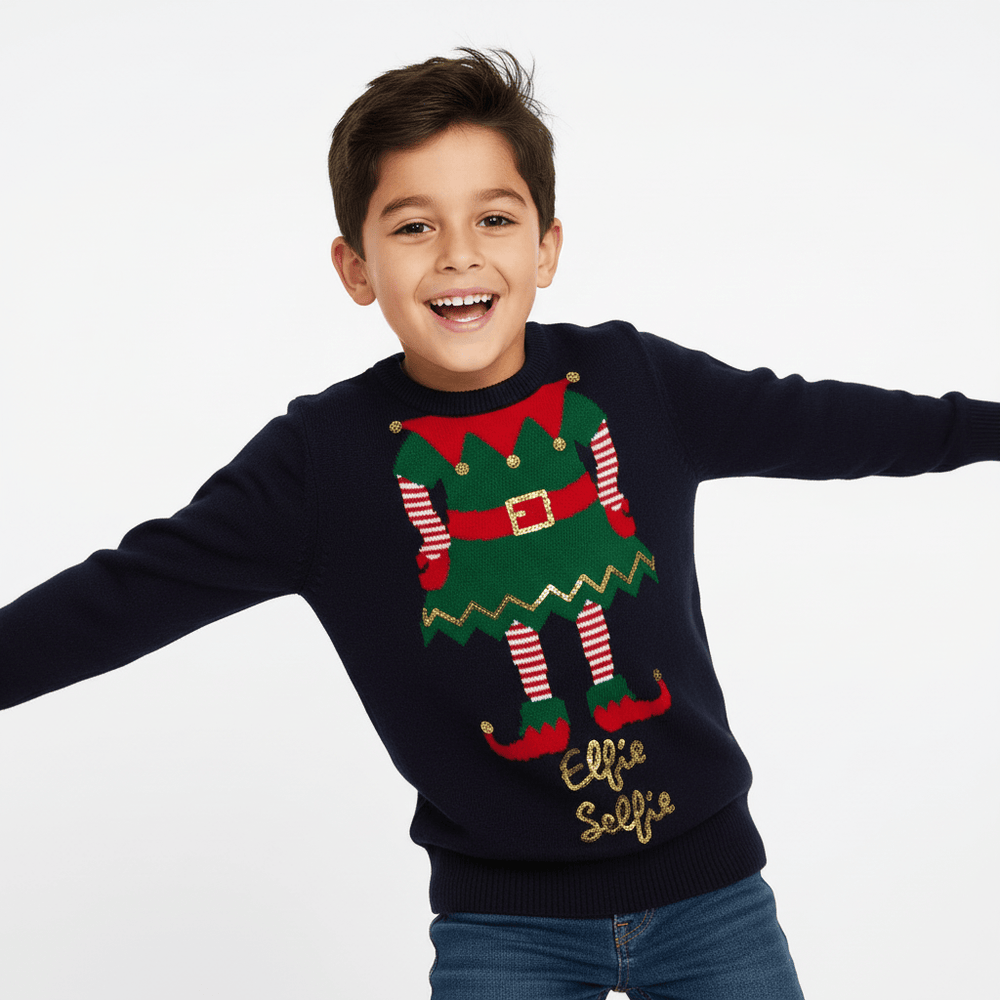 Child wearing a festive sweater with elf design on a plain background