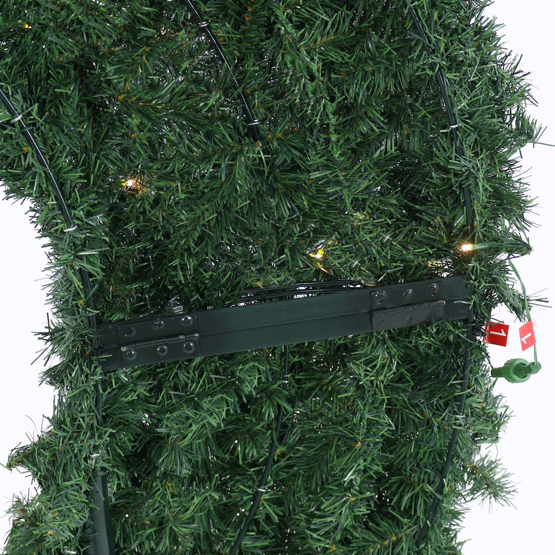 back view of moon shaped tree with metal stand and light connectors
