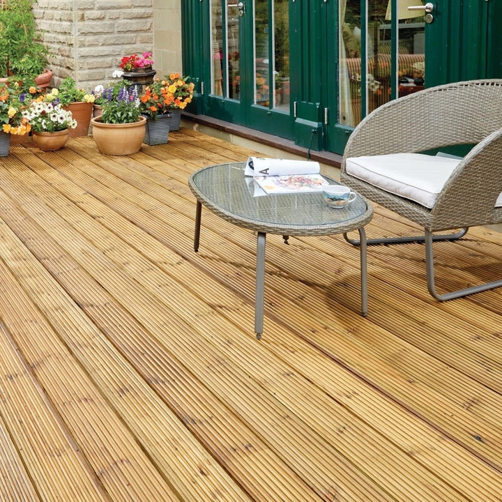 Wooden deck with outdoor furniture and potted plants