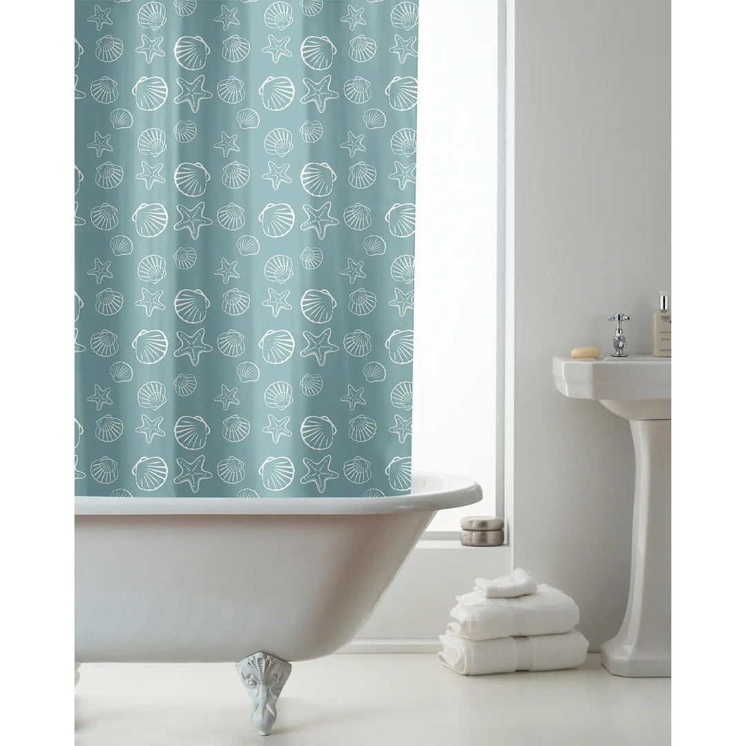 Teal blue shower curtain with seashells and starfish pattern in a bathroom