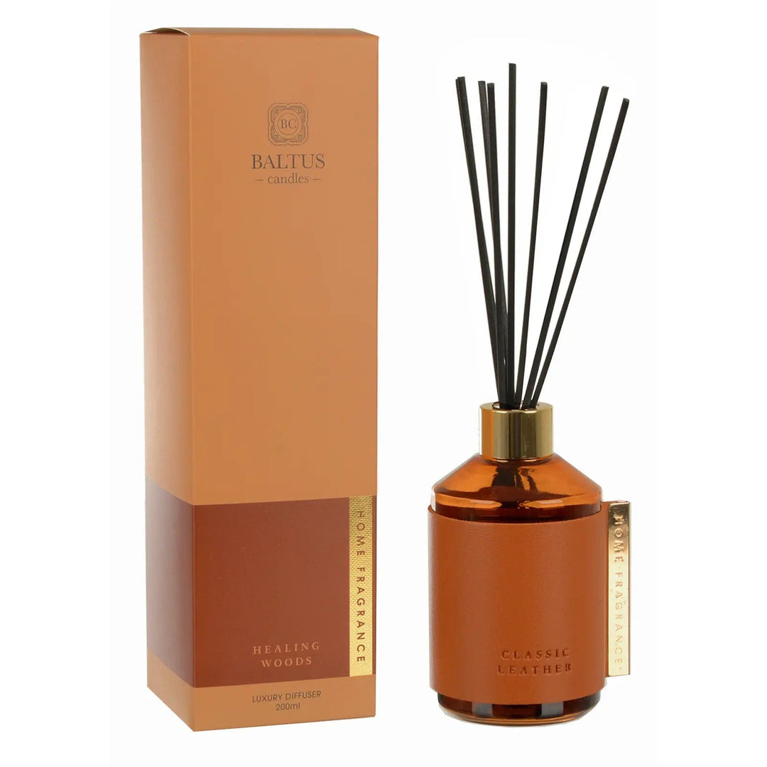 Healing Woods scented Classic Leather reed diffuser with gold tone clip and top, black reeds and box packaging