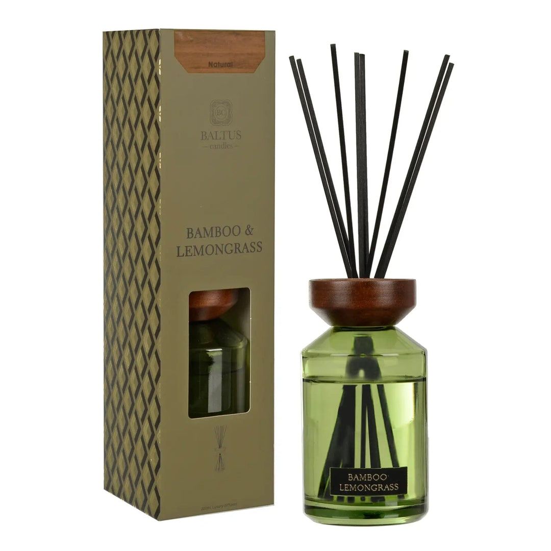 Bamboo & Lemongrass scented reed diffuser with wooden top and black reeds next to gift box packaging