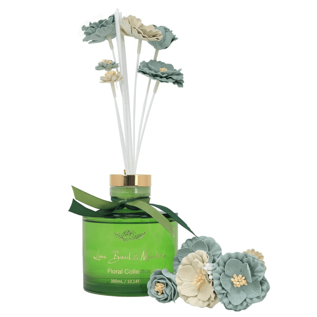 green bottle lime basil & mandarin reed diffuser with pale blue and white faux flowers