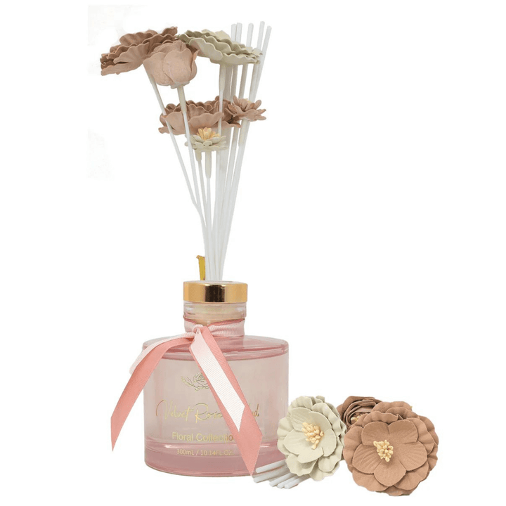 pink bottle reed diffuser with pink and white faux flowers with white reeds