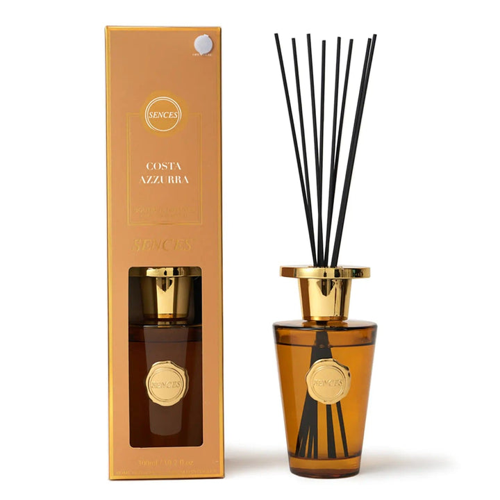 Costa Azzurra scented diffuser in orange with gold top bottle and black reeds