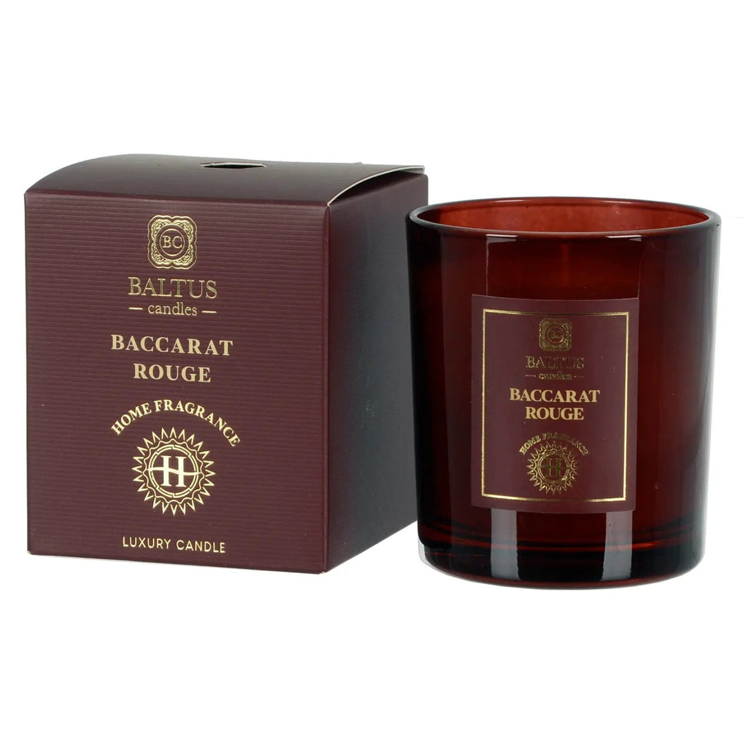 Baccarat Rouge scented candle in a dark red glass jar with gift box packaging