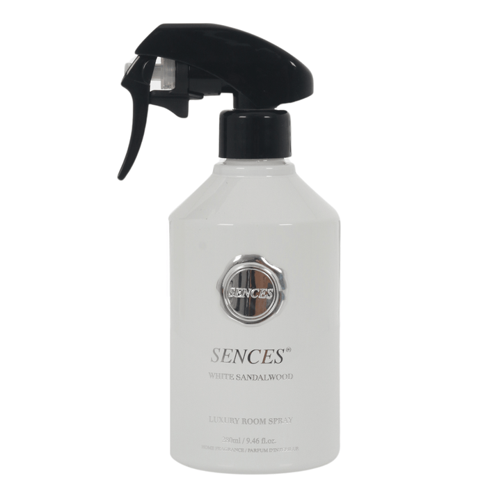 white sandalwood scented room spray in white glass bottle with silver brand and product details