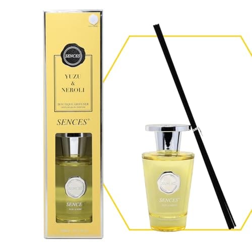 Sences Yuzu & Neroli reed diffuser with a yellow box, a clear glass bottle filled with pale yellow liquid, a silver cap, and a black reed stick on a white background.