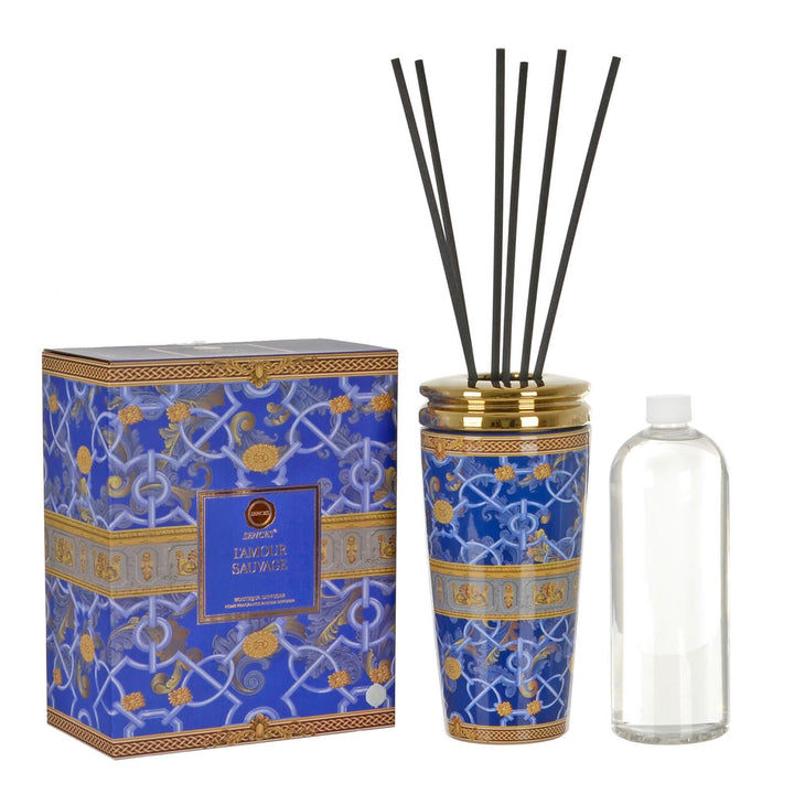 Decorative diffuser set with blue patterned container, packaging, and clear bottle on a white background