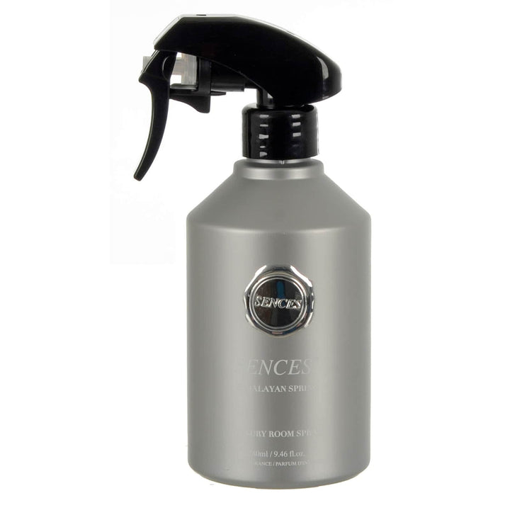 Silver spray bottle with black nozzle on a white background