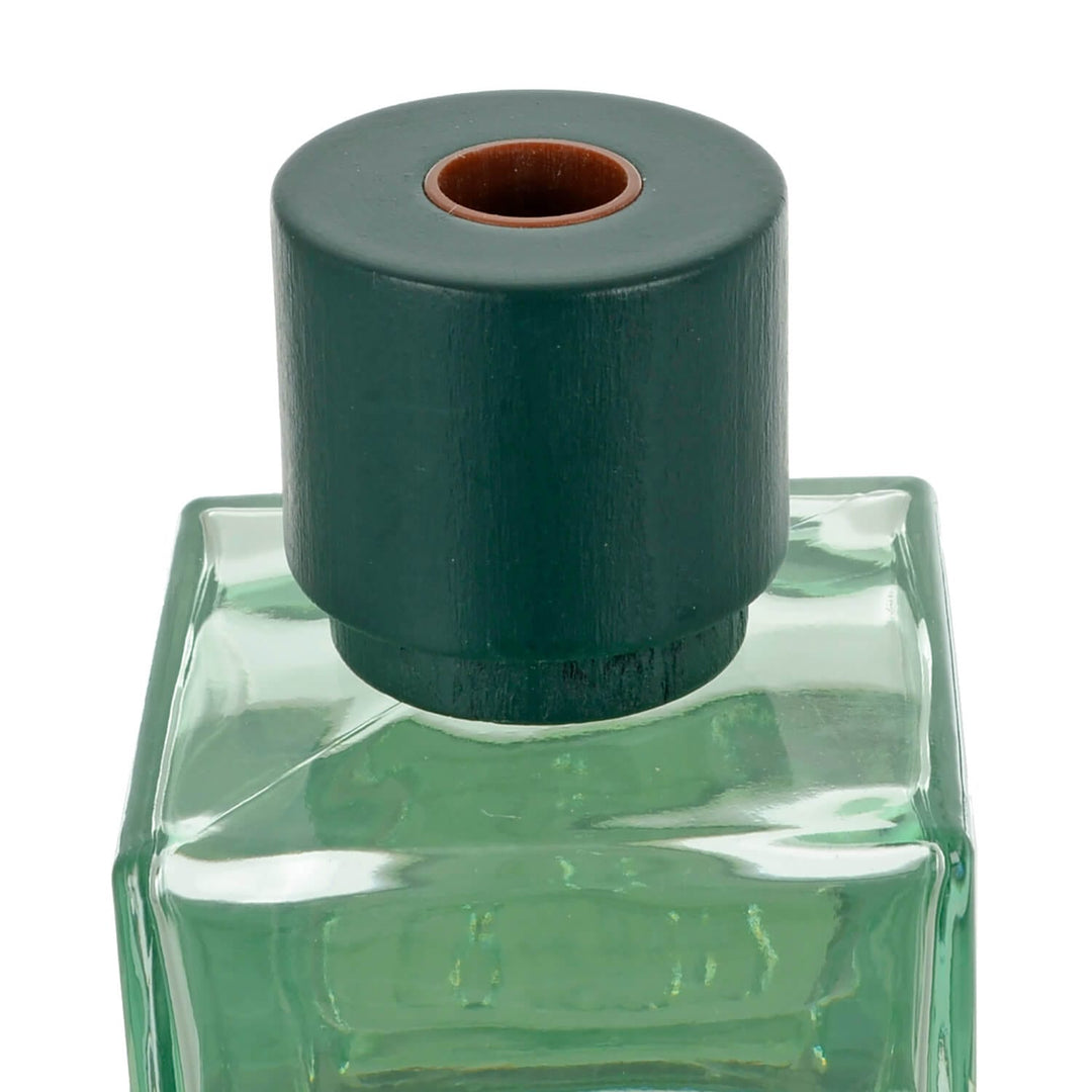 Close up of green wooden lid on a diffuser bottle