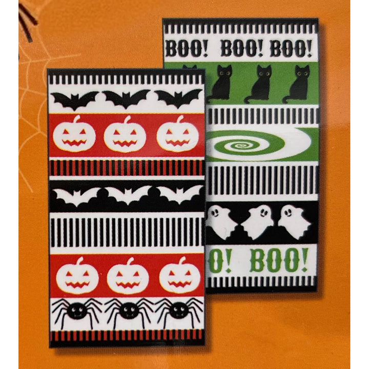 Two Halloween-themed tea towels displayed on an orange background. One features red, white, and black stripes with pumpkins, bats, and spiders.