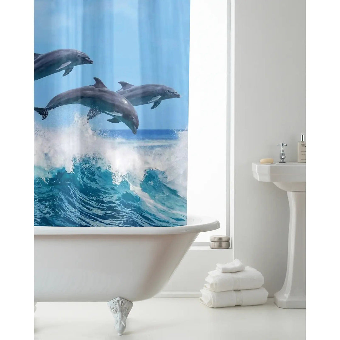 Bathroom with shower curtain featuring dolphins and breakign waves