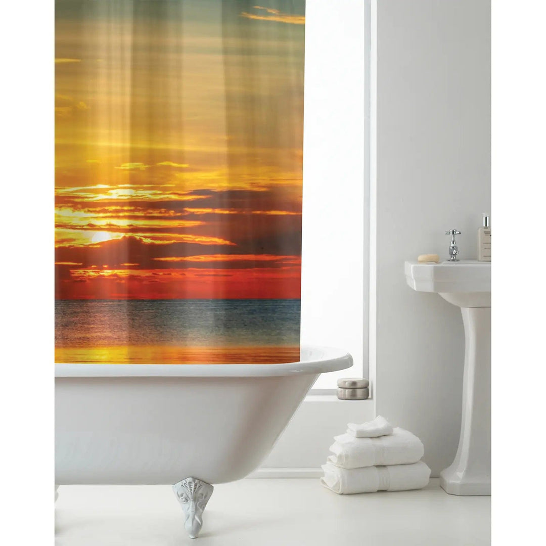 White bathroom with Sunset design shower curtain  in shades of orange, yellow and red