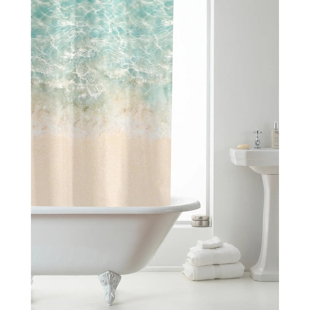 White bathroom with beach pattern shower curtain in sand and aqua blue