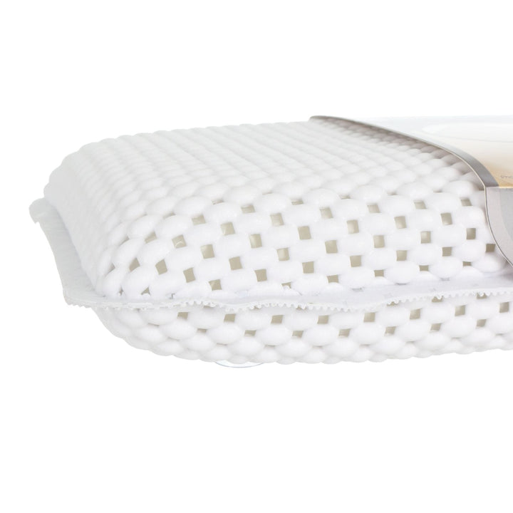 side view of bath pillow highlighting thickness with soft foamy outer